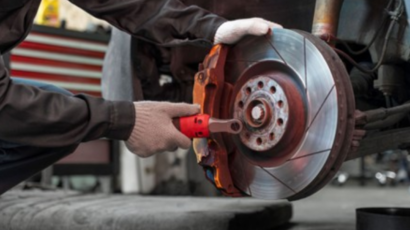 Certified mechanic performing brake pad replacement In Brisbane