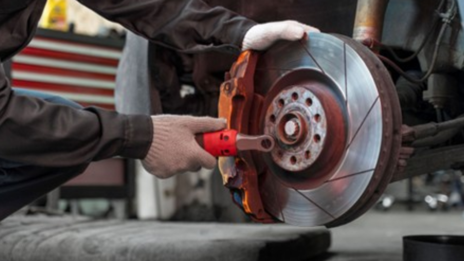 Certified mechanic performing brake pad replacement In Brisbane